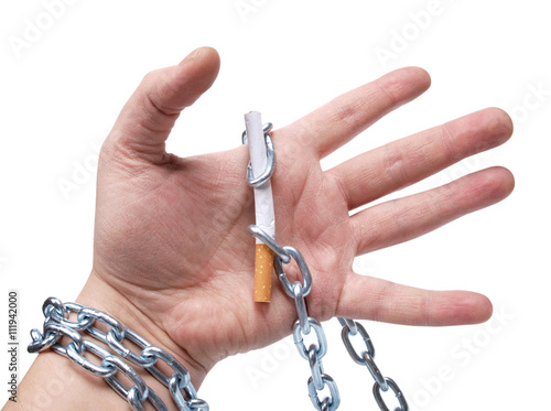 Fotografie Mans hand with cigarettes on white bacground