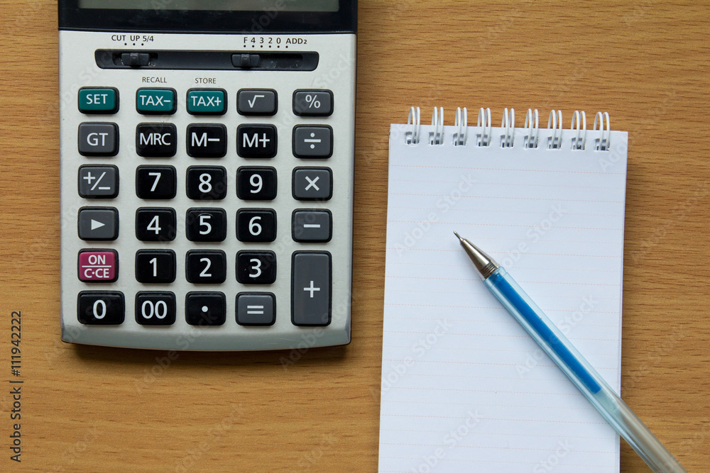 Calculator, notebook and pen Calculator, notebook and pen