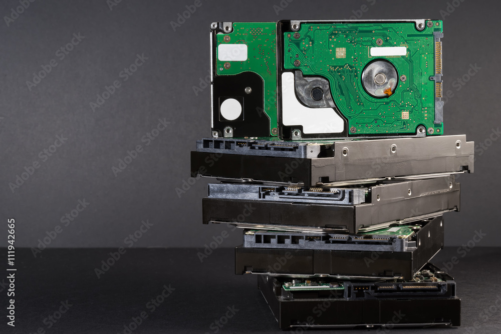 Obraz premium pile of hard drives at black background