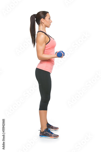 Sporty woman with dumbbells