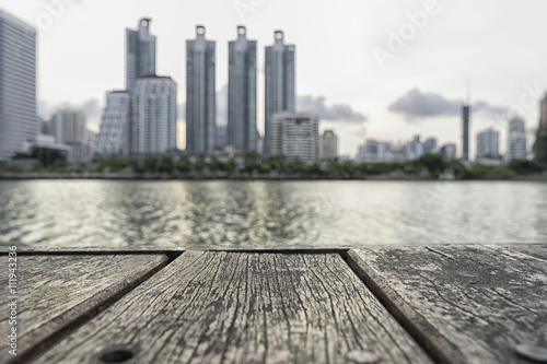 wood table top on blur cityscape background