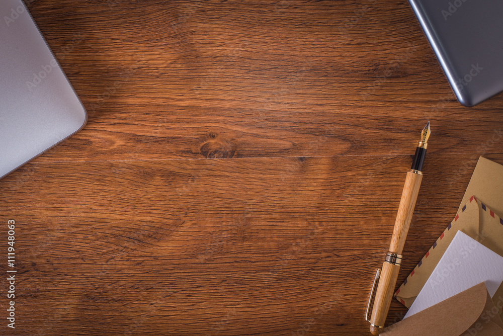 Wood table with pen and notebook