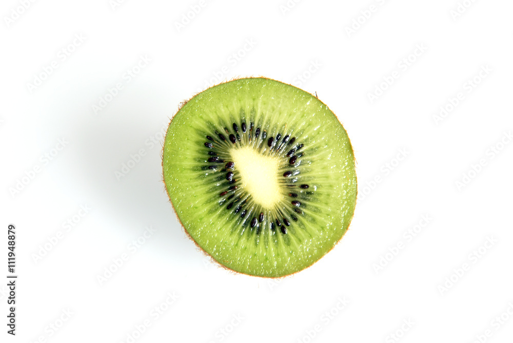 Cut in half kiwi fruit with green pulp and black seeds isolated on white background Cut in half kiwi fruit with green pulp and black seeds isolated on white background