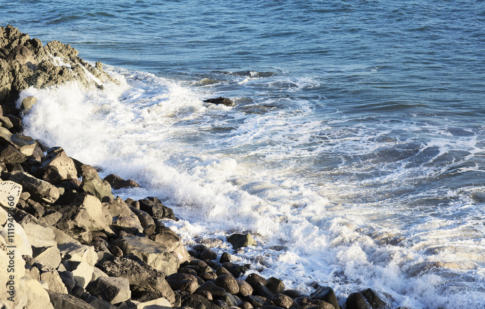 The waves of the Pacific ocean, the beach landscape. The ocean and waves during strong winds in United States, Santa Monica. Waves breaking on the rocks. The waves of the Pacific ocean, the beach landscape. The ocean and waves during strong winds in United States, Santa Monica. Waves breaking on the rocks.