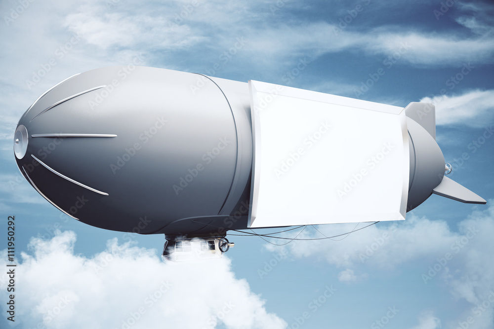 Fototapeta premium Airship in cloudy sky side