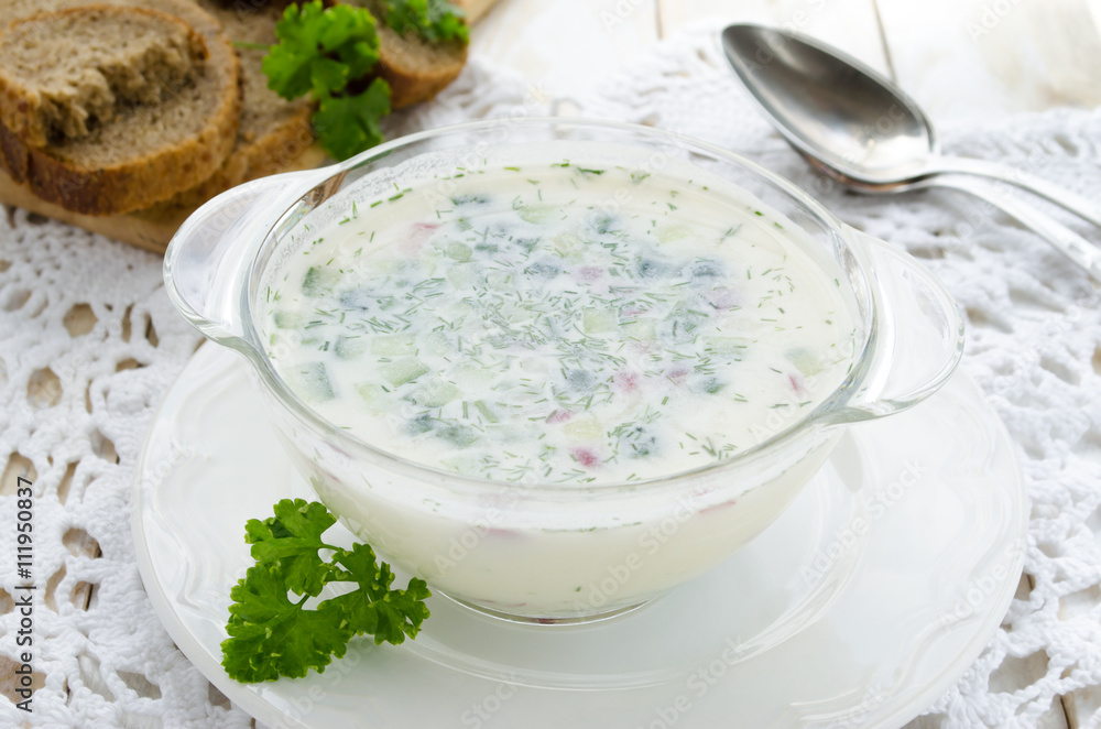 Cold soup Okroshka with fresh vegetables on white background Cold soup Okroshka with fresh vegetables on white background
