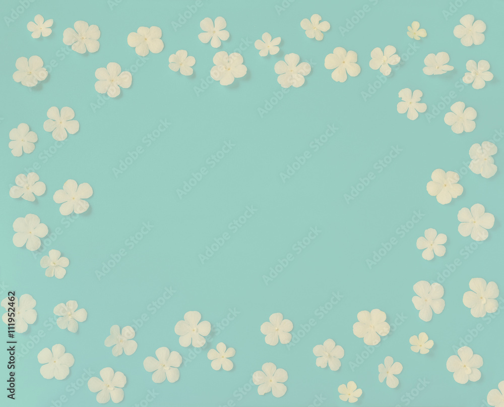 beautiful wreath white flowers on vintage blue background, close