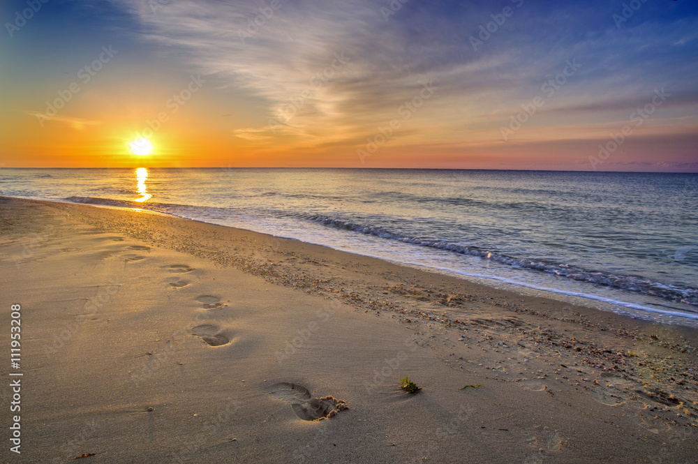 Beautiful seascape, footprints in the sand Beautiful seascape, footprints in the sand