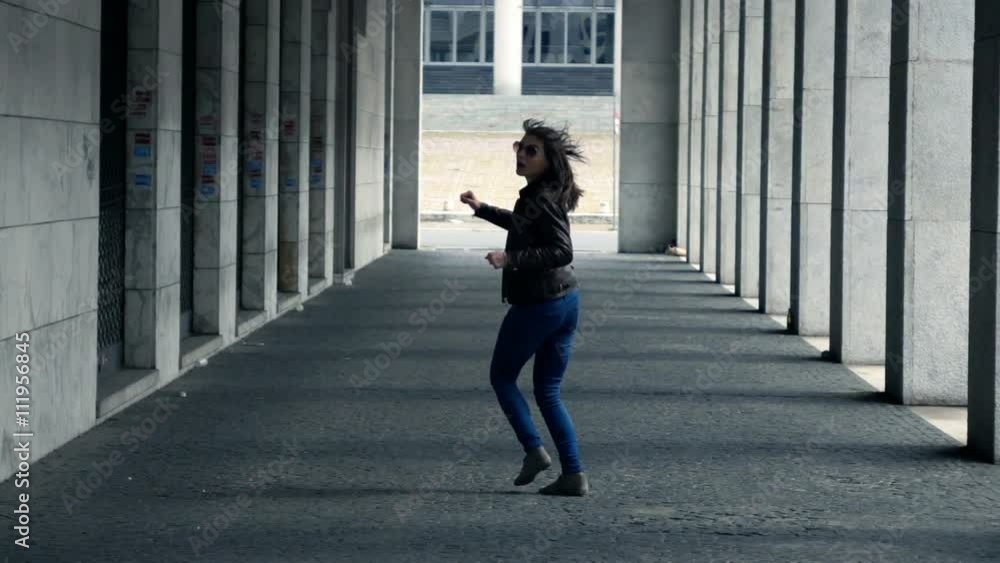 Afraid, scared woman running through city, super slow motion 240fps