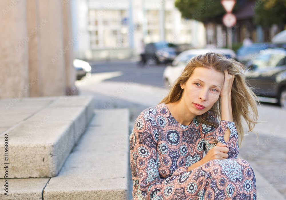Attractive young woman resting in city