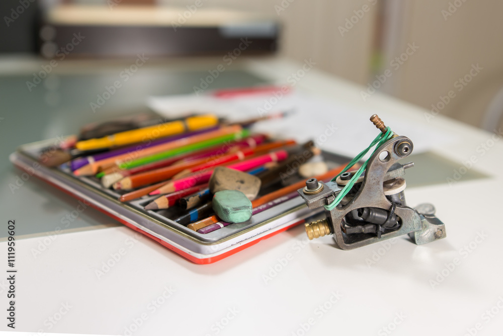 Fototapeta premium Master tattoo artist prepares the transfer tattoo sketch