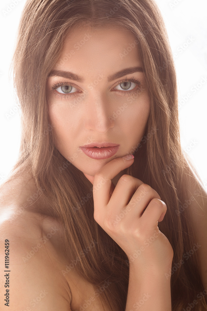 Closeup portrait of beautiful model lady posing for photographer over white background in studio. Fashion and vogue concept. Closeup portrait of beautiful model lady posing for photographer over white background in studio. Fashion and vogue concept.
