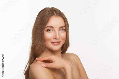 Portrait of smiling beautiful shirtless lady with red lips posing for photographer over white background in studio. Studio shot. Shoulders beauty concept.