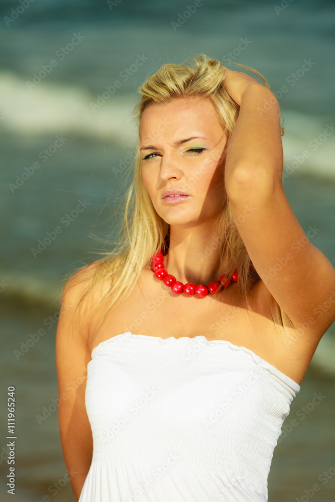 Young lady resting on beach.