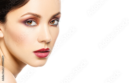 Beautiful adult woman face with smokey makeup on white backgroun