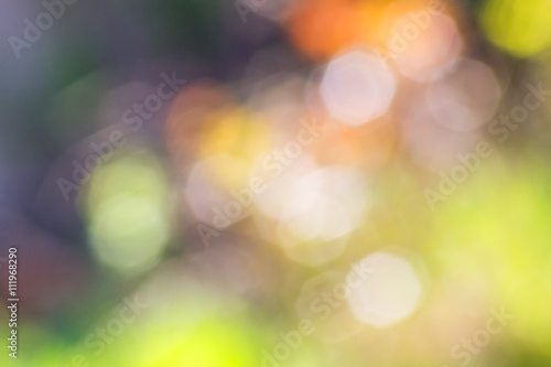Abstract purple and green background with blurred colored spots