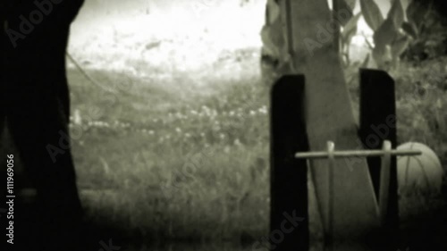 Young boy playing with parent - retro, 1950's old camera footage	