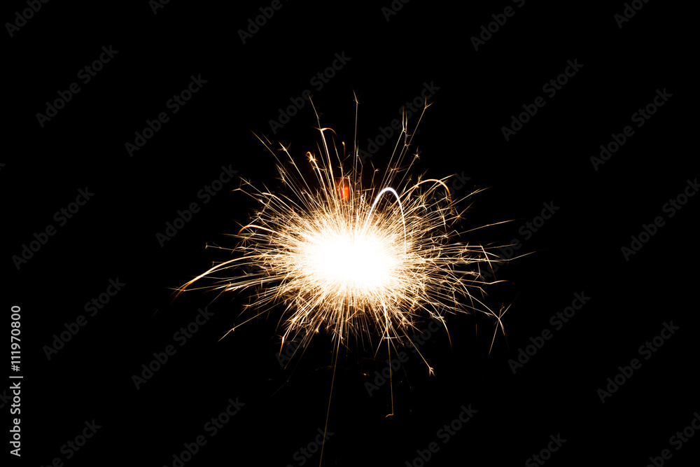 Sparkler on black background, close-up Sparkler on black background, close-up