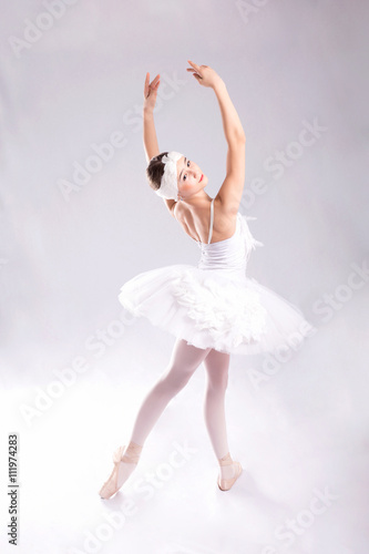 Ballerina is dancing on a white background
