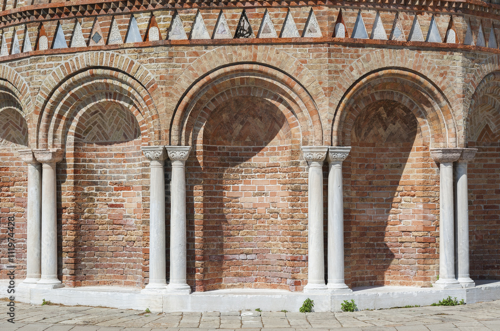 Classical wall with graceful columns and arches in Venice, Italy