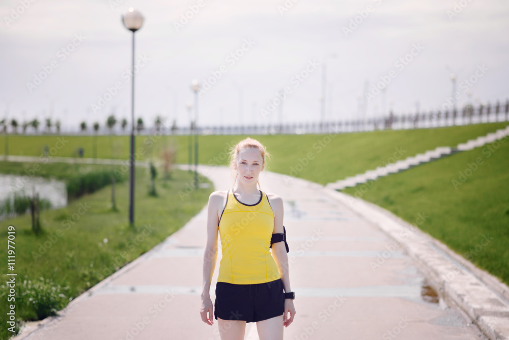 Young woman portrait in sport's clothes.