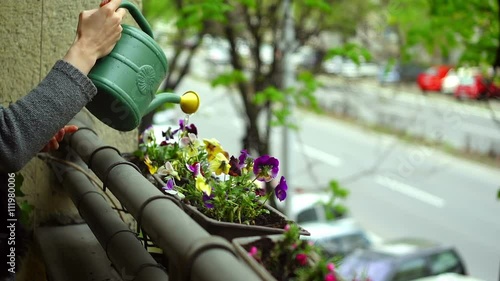 Super 35mm camera - watering flowers on a balcony
