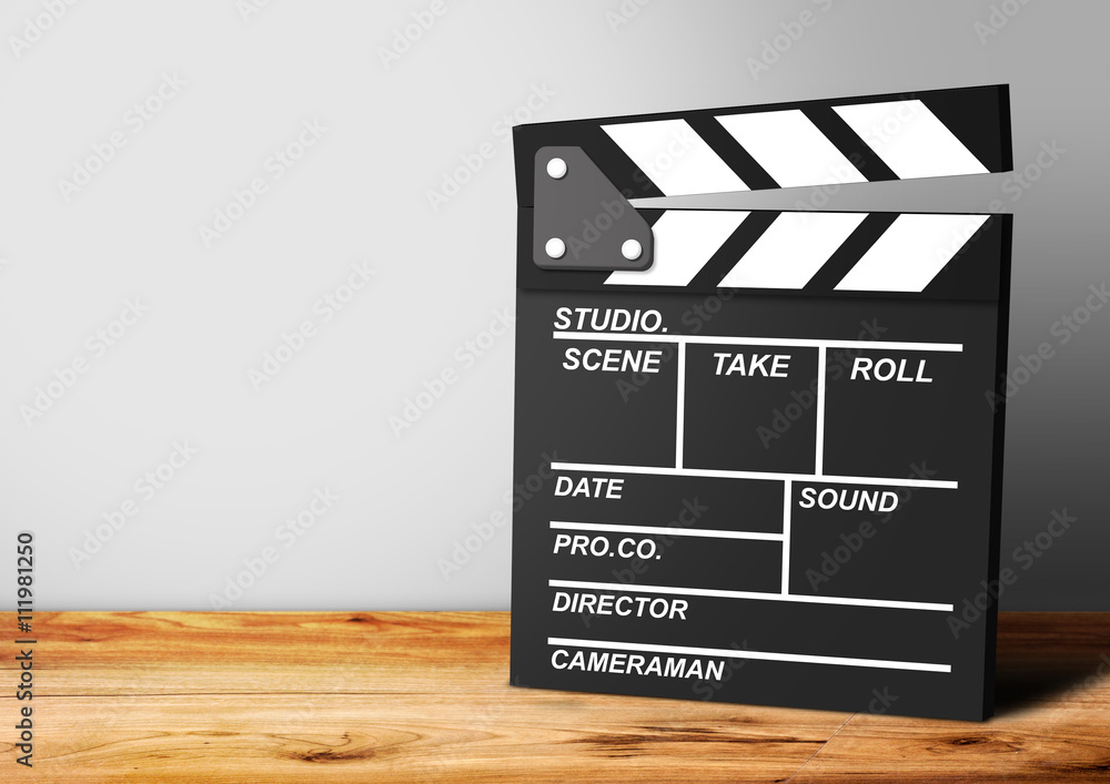 Film Clapboard on wooden background