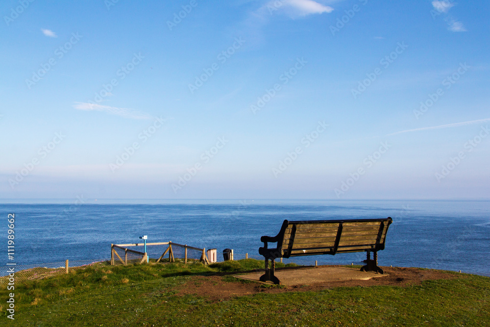  Empty bench over looking the coast in Bude, Cornwall