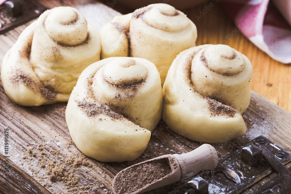 Making cinnamon buns. Homemade yeast dough after raising Making cinnamon buns. Homemade yeast dough after raising