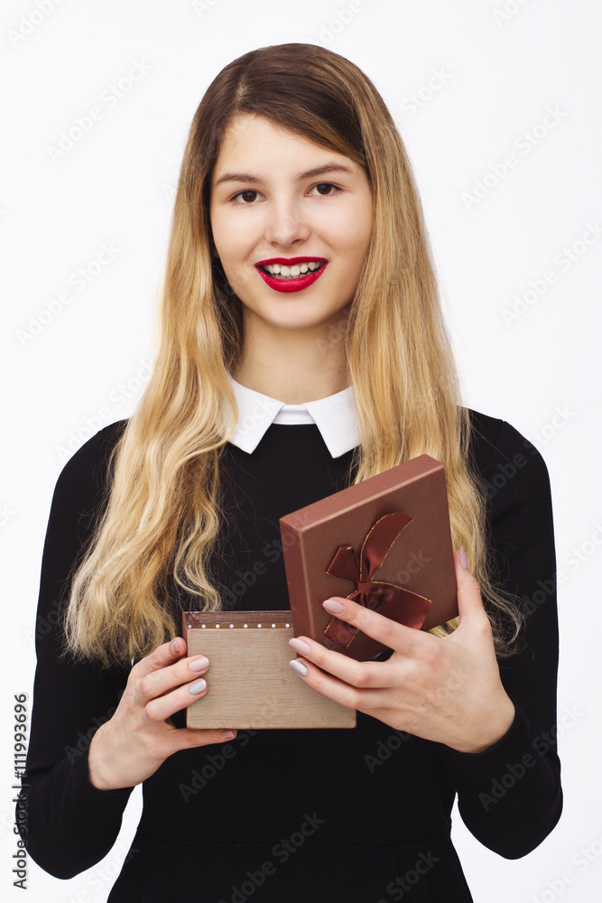 Young woman portrait holding gift Young woman portrait holding gift
