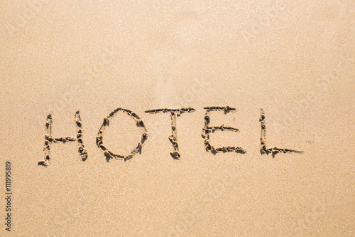 word HOTEL on the sand
