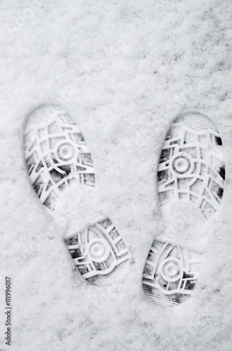 prints from shoes in the snow