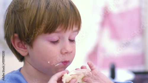 SUPER 35MM CAMERA - Young boy eating a sandwich for breakfast
