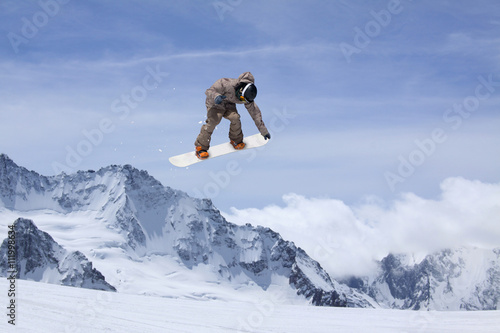 Photography Snowboard rider jumping on mountains
