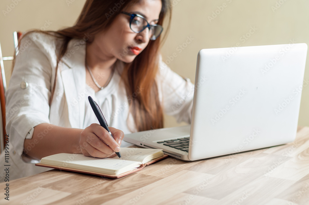 Indian Businesswoman working at office with laptop Indian Businesswoman working at office with laptop