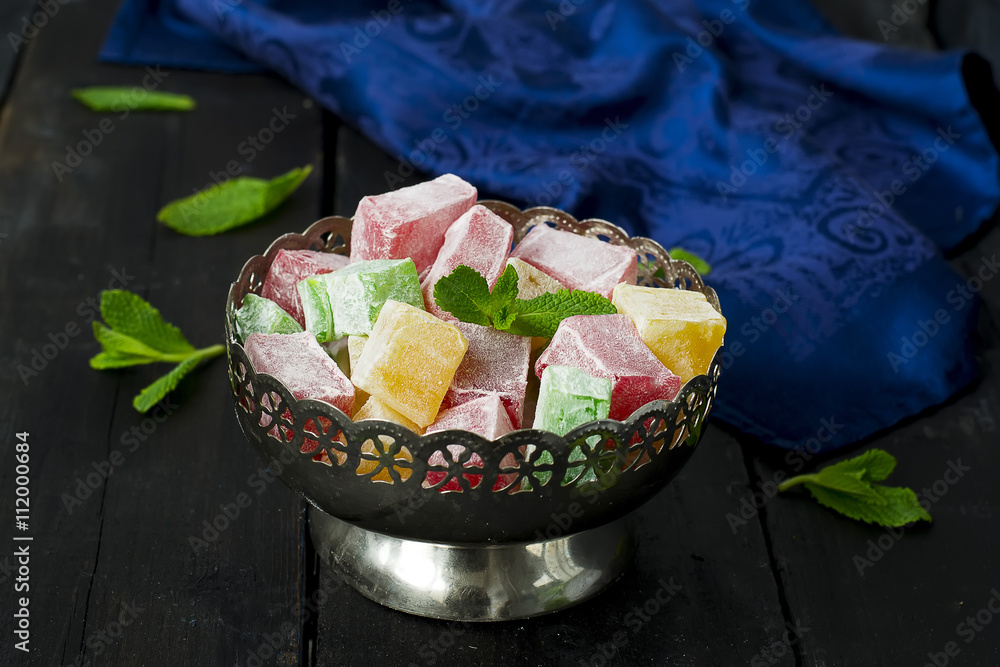 Fototapeta premium lokum - traditional Turkish sweets on a dark background