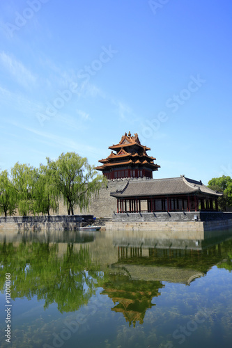The Forbidden City turrets   under the blue sky white clouds