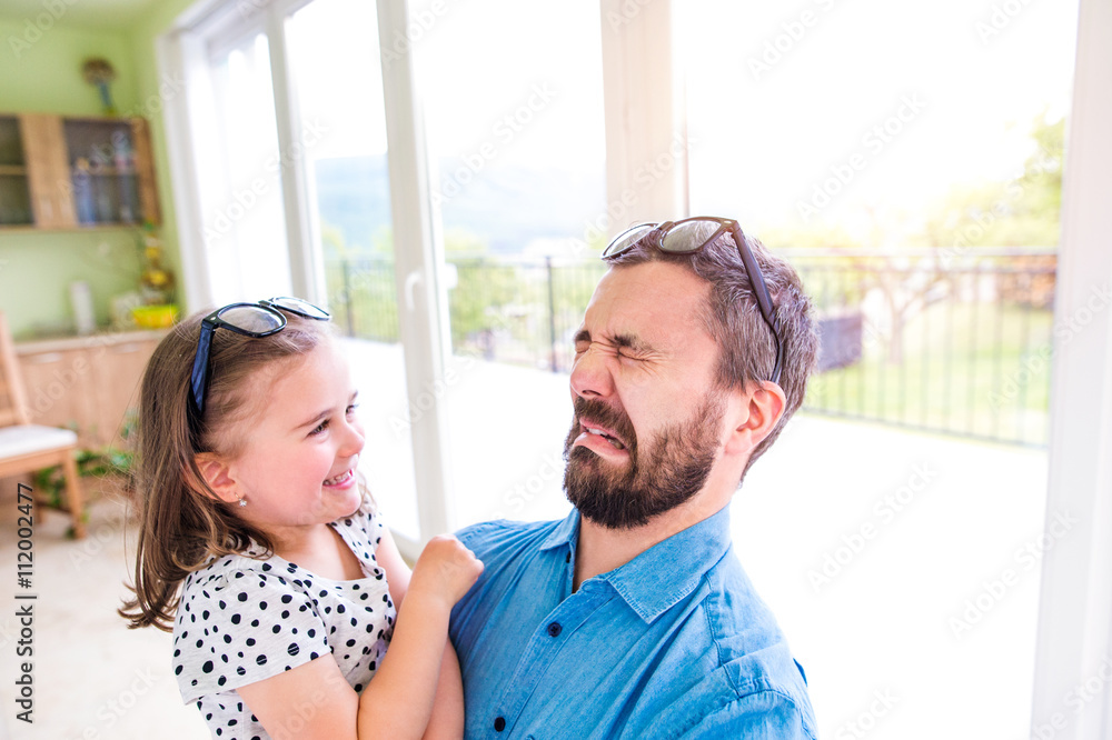 Father with his little daughter making funny face Father with his little daughter making funny face