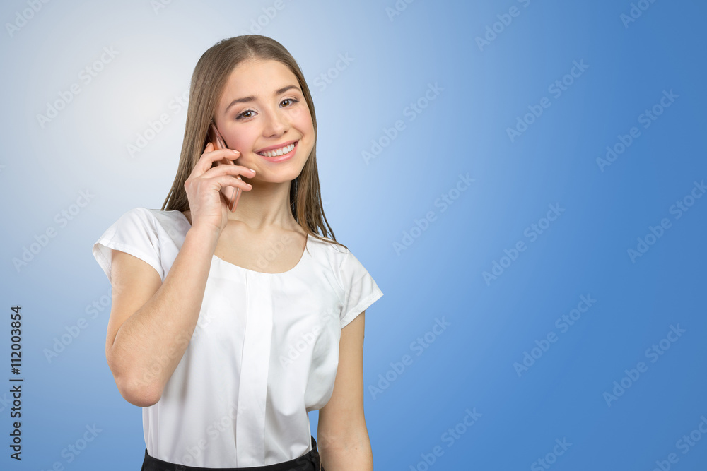 Young elegant woman talking on mobile phone Young elegant woman talking on mobile phone