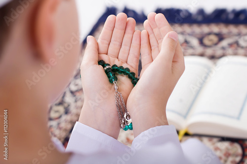 Ramadan Portrait - Little Muslim kid making duaa (praying to All