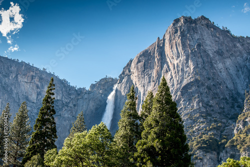 Looking up to Large Fall with trees in the foreground photo