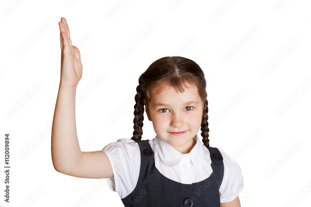 Elementary school child raising her hand up. Elementary school child raising her hand up.