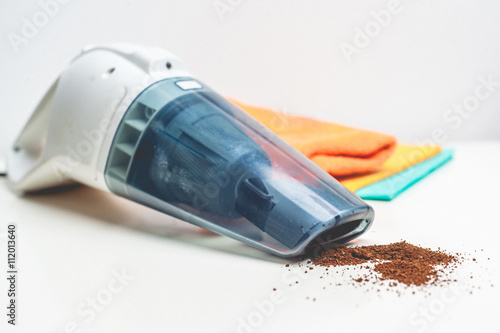 Vászonkép a hand-held vacuum cleaner on a white background