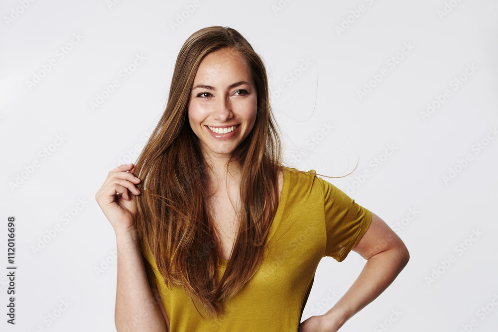 Fototapeta premium Confident woman in white studi