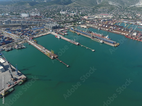Industrial seaport, top view. Port cranes and cargo ships and barges. © eleonimages