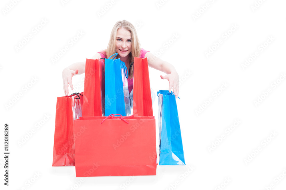 Young happy smiling woman posing with shopping bags