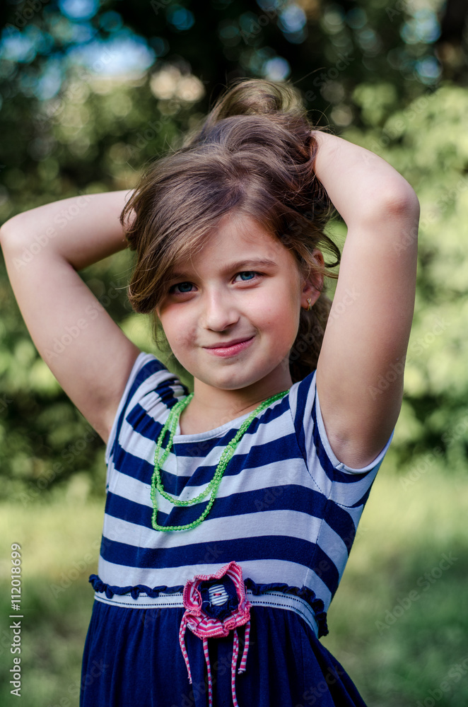 Cute  little girl summer portrait.