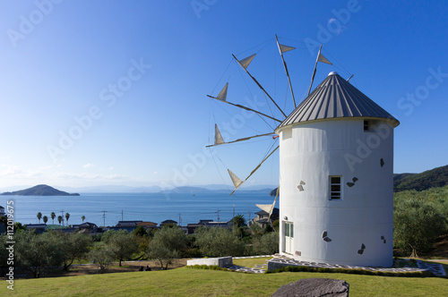 Windmill of olive park and look down on the blue sea like the Mediterranean from the top of the hill. 小豆島オリーブ公園の風車の立つ丘からまるで地中海のように青い瀬戸内海を見下ろす風景