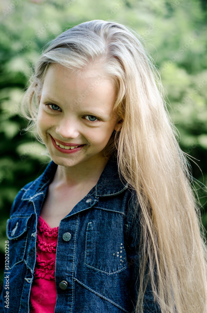 Portrait of a beautiful blonde little girl with long hair Stock Photo ...