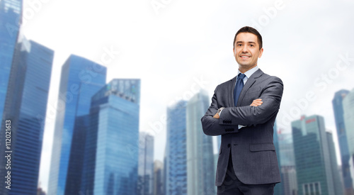Photography happy smiling businessman over singapore city